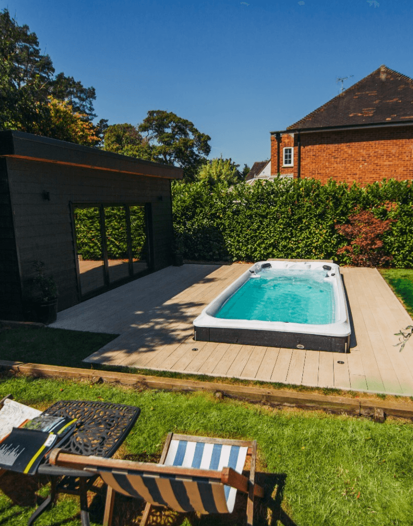 Swim spa set into a sunny garden deck